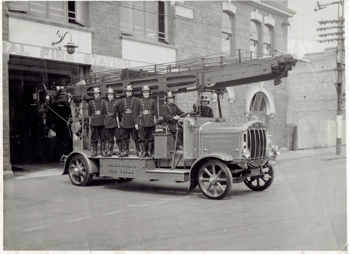 Firefighters and a Tilling-Stevens fire escape at Christchurch Central Fire Station in 1948
